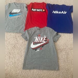Bundle of 4 Nike shirts for boys.